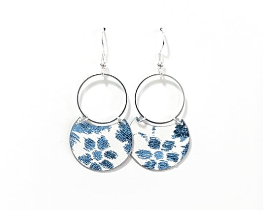 Beautiful blue floral print earrings in crescent shape with delicate silver circles. Handmade with upcycled wallpaper by Gracie Nicole.