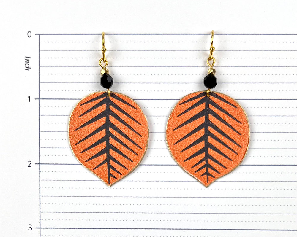 Playful Orange and Black Leaf Earrings with Bead Accents