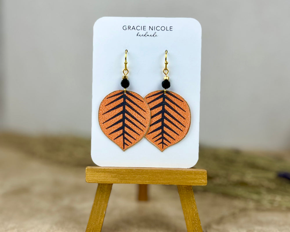 Playful Orange and Black Leaf Earrings with Bead Accents