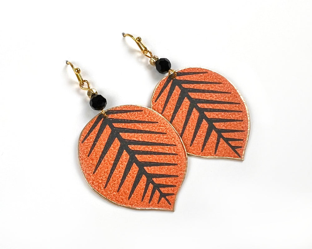 Playful Orange and Black Leaf Earrings with Bead Accents